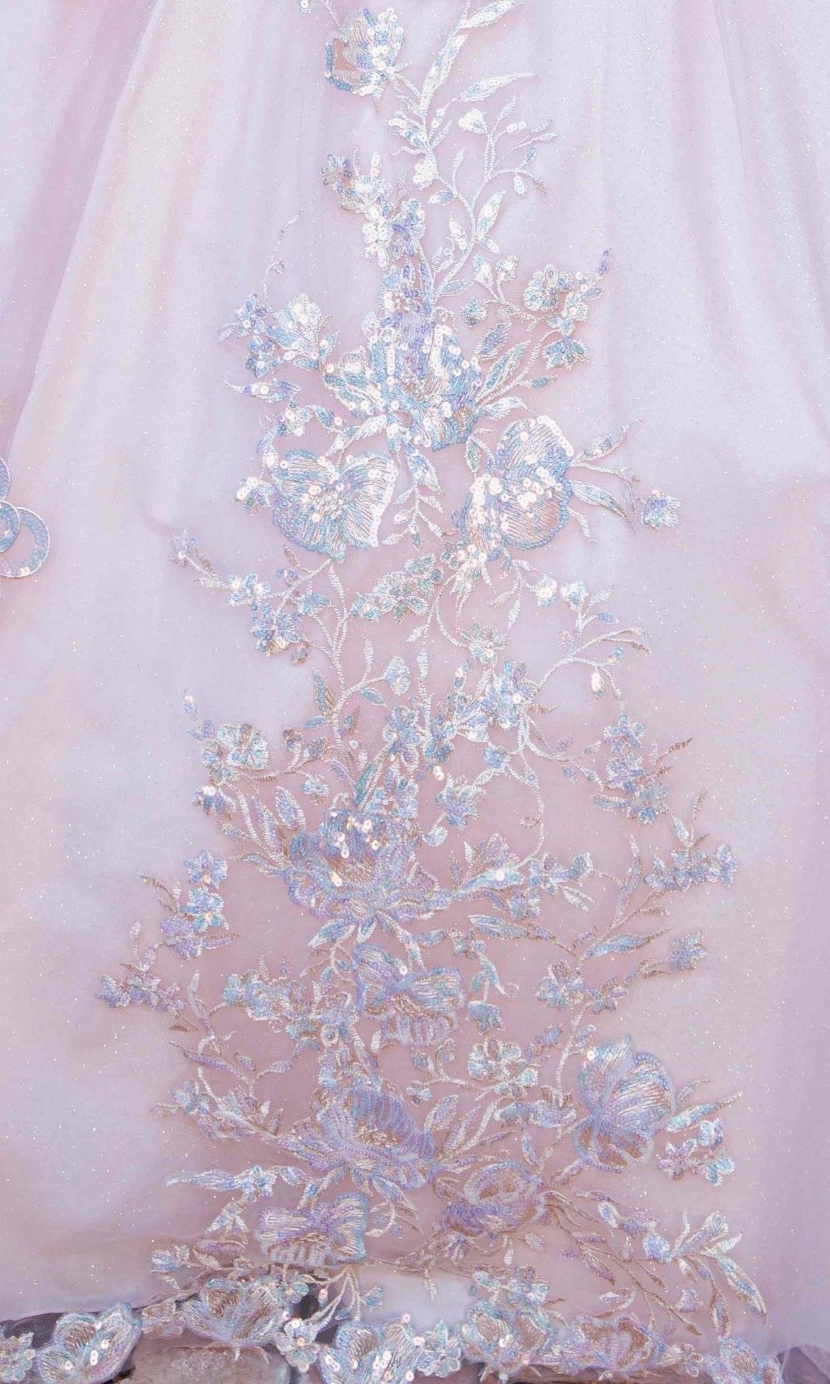 Close-up of the intricate, iridescent floral embroidery on the Quinceanera Dress 8370J By Cinderella Couture, featuring detailed flowers and leaves with shimmering threads—perfect for a quinceanera ball gown with delicate floral appliques.